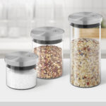 Wood table top on blur kitchen counter (room)background.