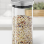 Wood table top on blur kitchen counter (room)background.