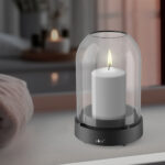 A scented candle on a white table with vases on a modern minimalist background. AI generative