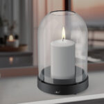A scented candle on a white table with vases on a modern minimalist background. AI generative