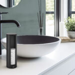 Stylish white sink in modern bathroom interior. Open space brigh